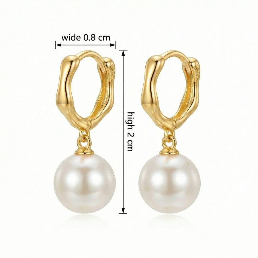Wavy sterling silver huggie earrings with pearl drops