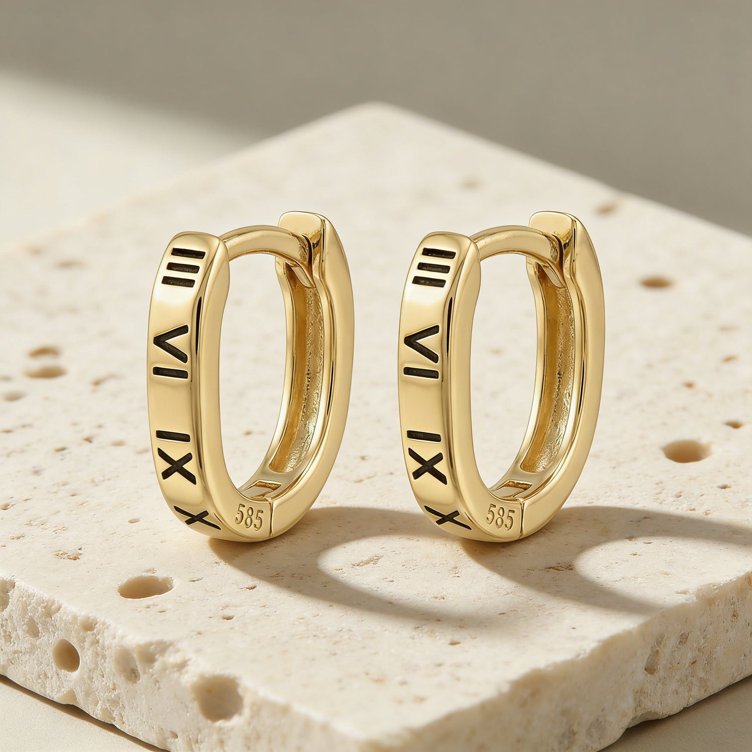 Roman numeral sterling silver oval huggie earrings